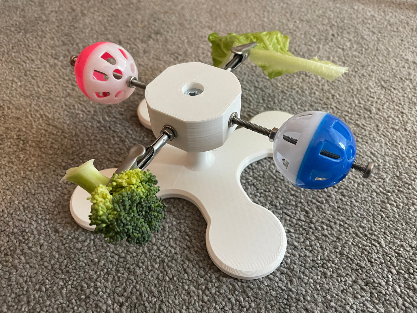 Rotating Bird Toy With Food Clips To Hold Treats.