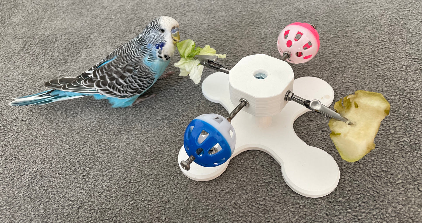 Rotating Bird Toy With Food Clips To Hold Treats.