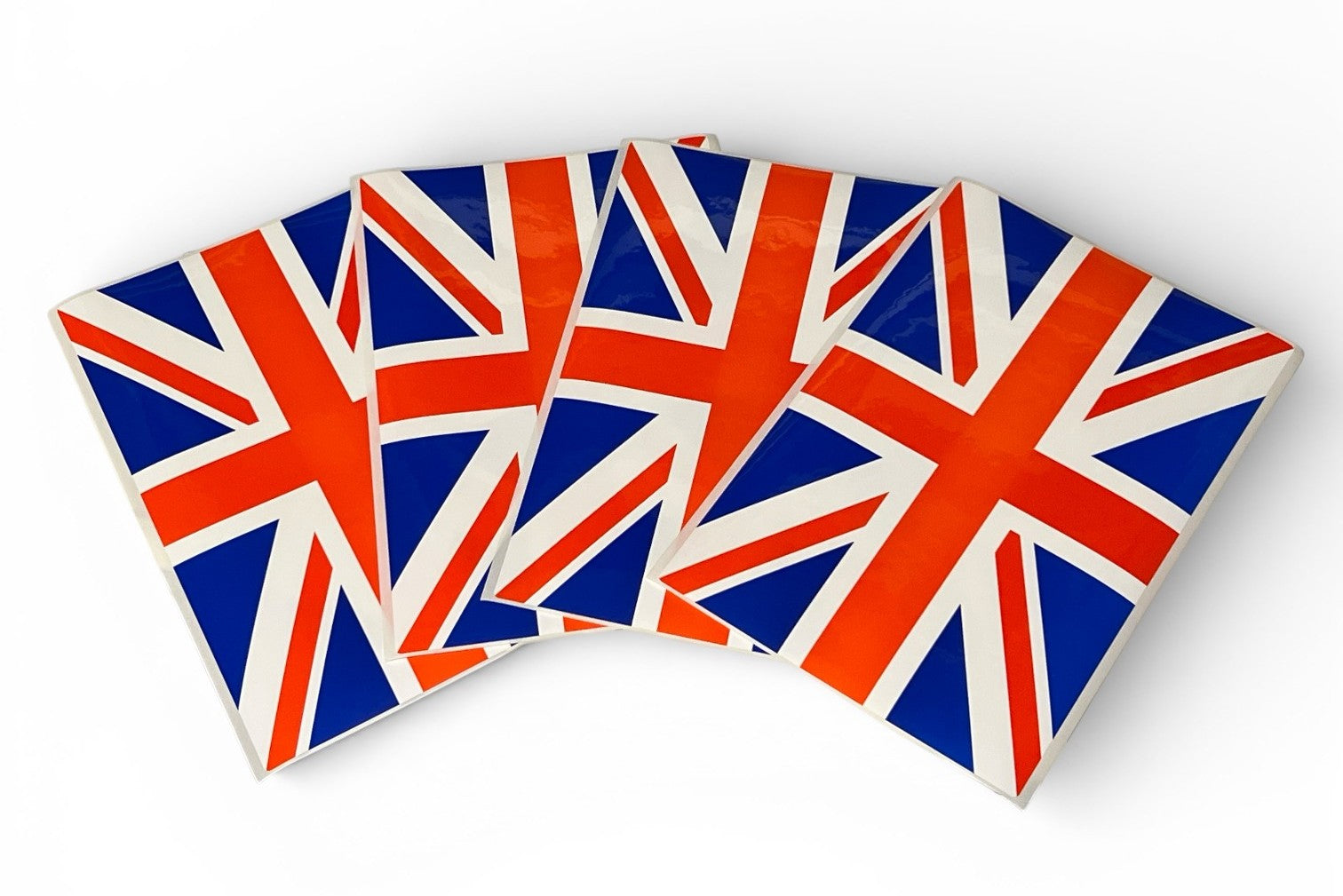 Four Union Jack flags arranged in a fan-like pattern on a white background